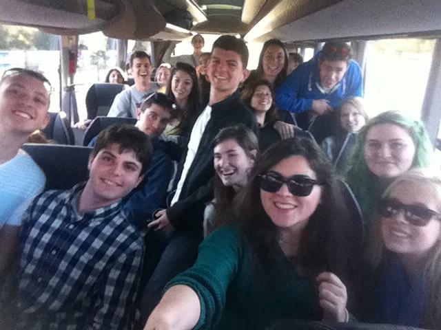 Soraya Pérez, cultural coordinator for the Seville office, with a group of her students on a bus going on an adventure