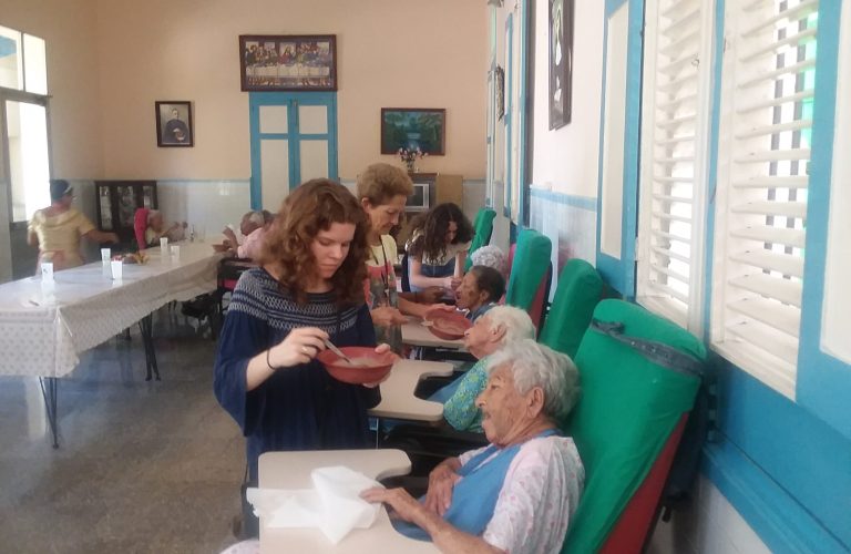 Students helping the elderly in Havana