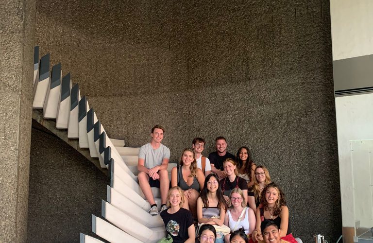 Students take picture on a cool spiral staircase on a day out in Barcelona